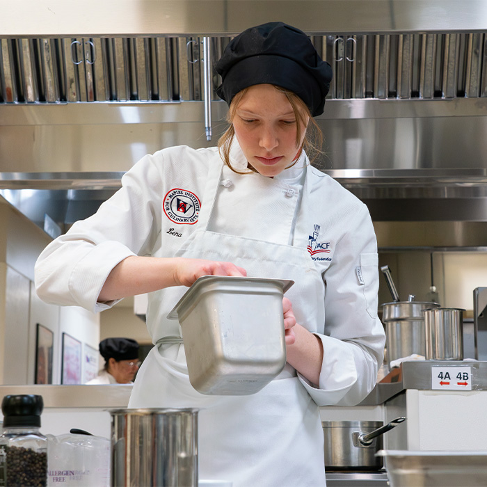 A Walters State student in culinary class