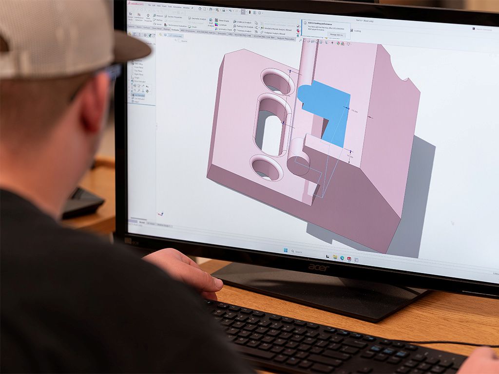 A student working with Computer Aided Design software.