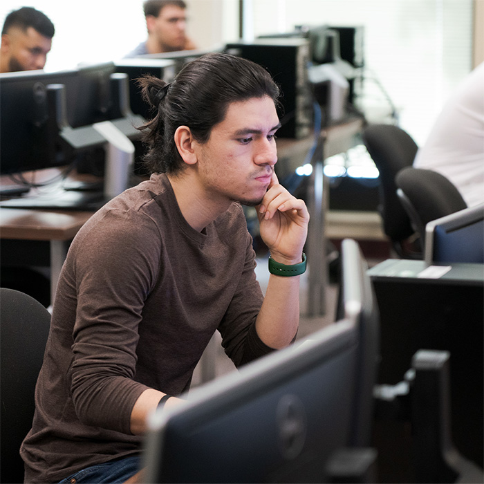 A student using a computer.