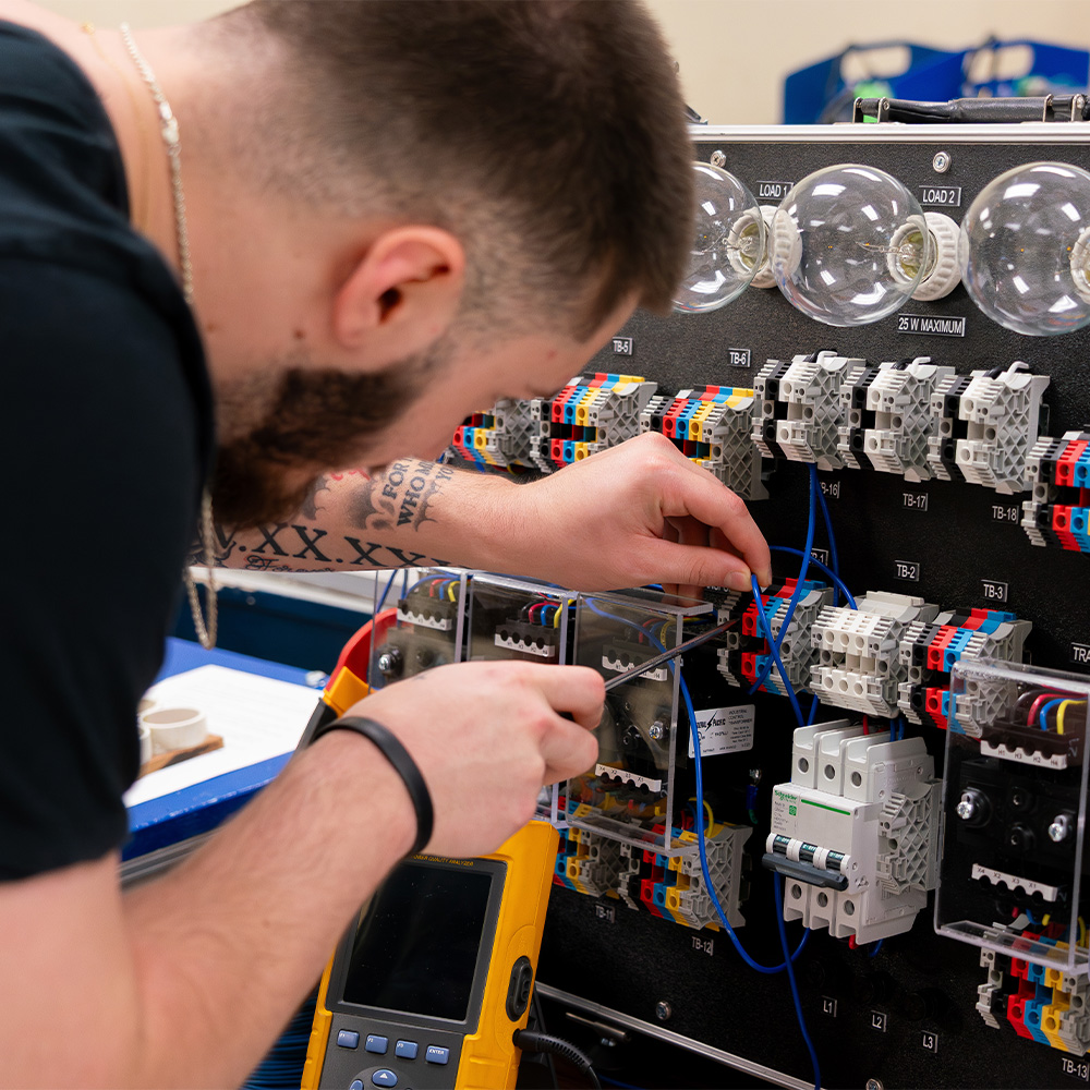 An engineering student working with equipment.