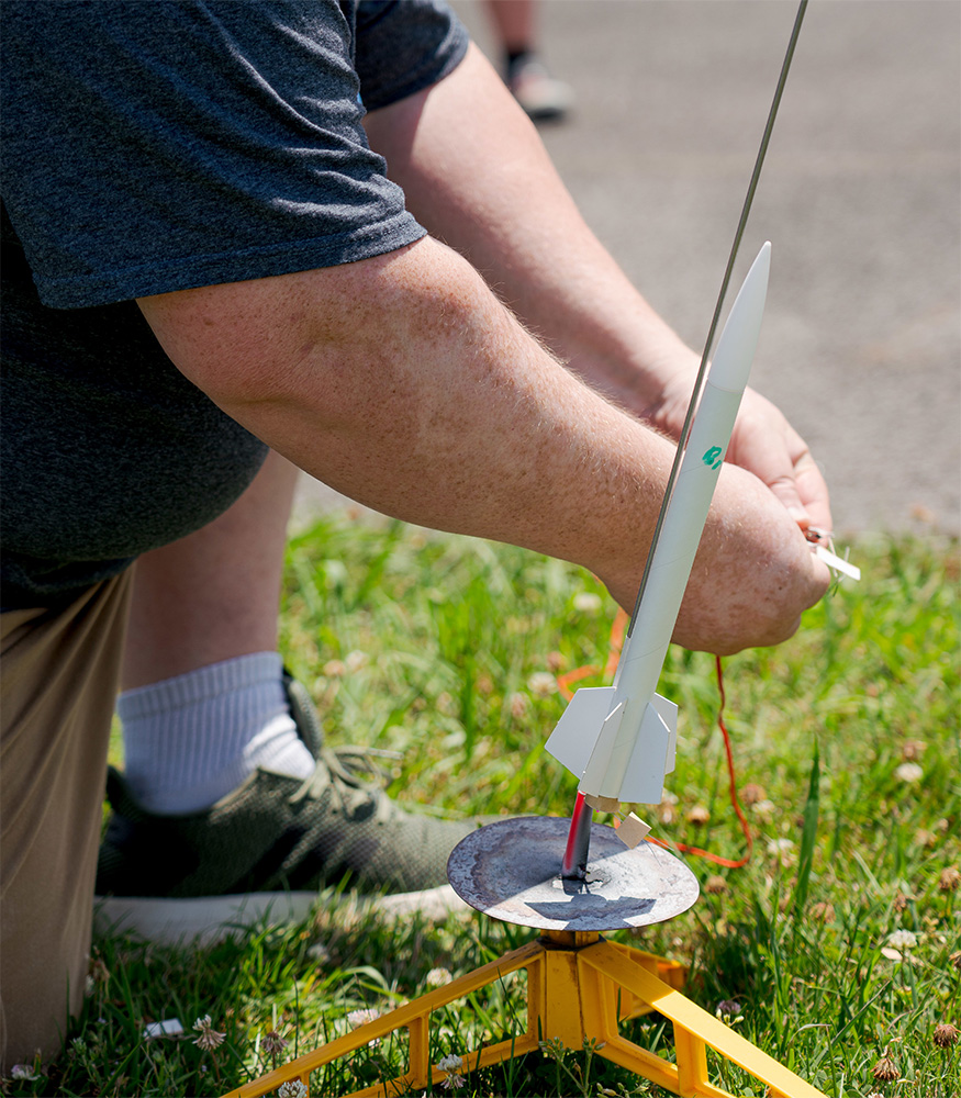 A person launching a rocket.