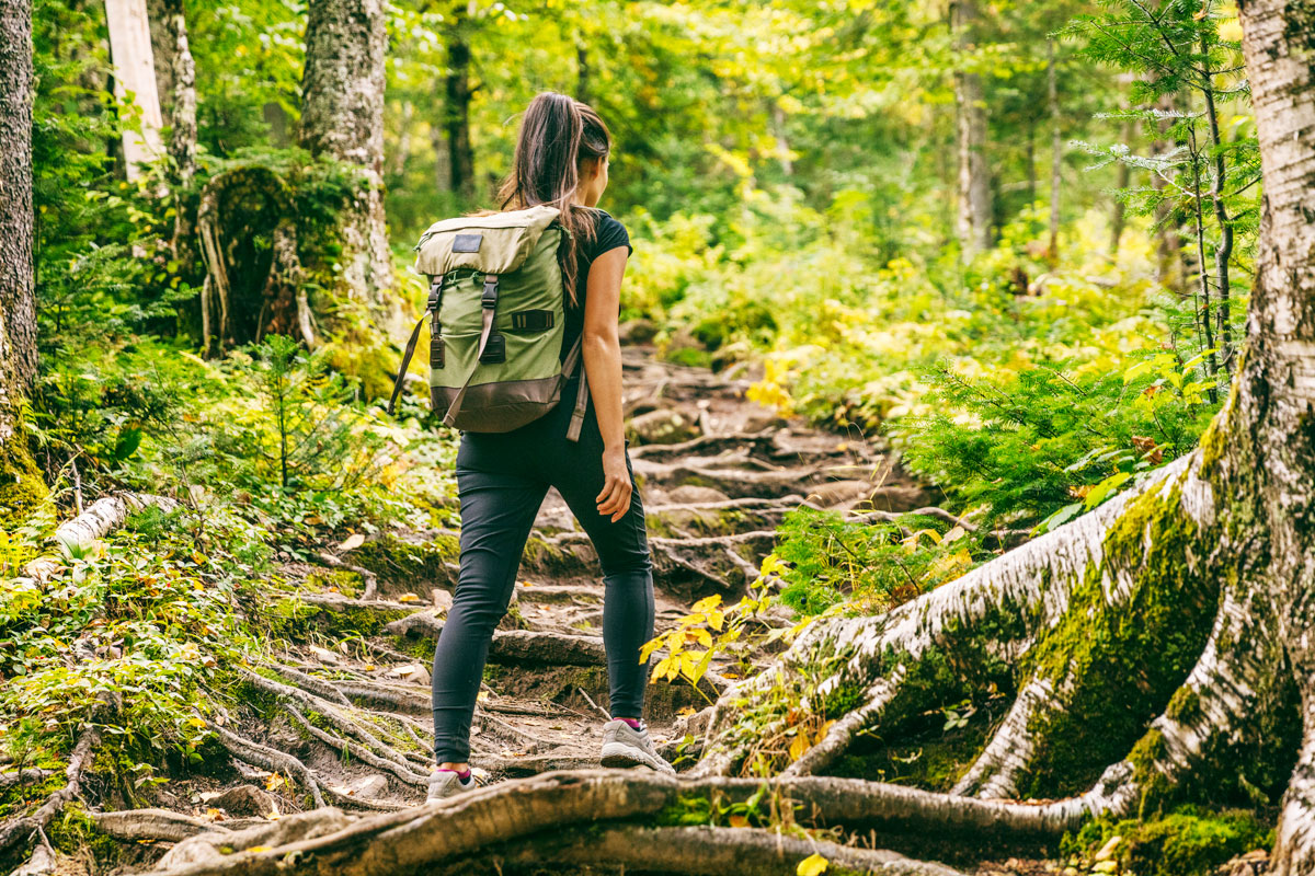 A person hiking toward Adventure.